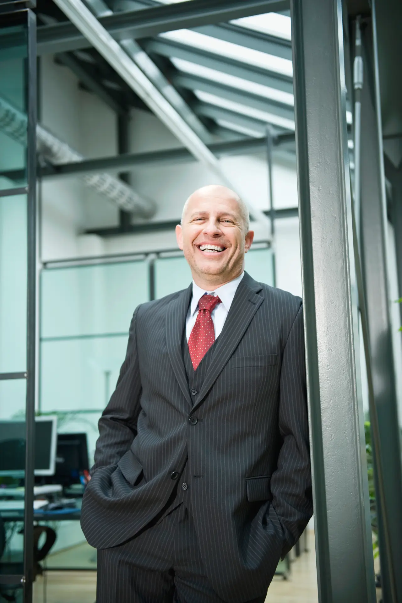 Portrait of George White, program coordinator, standing in a professional office setting